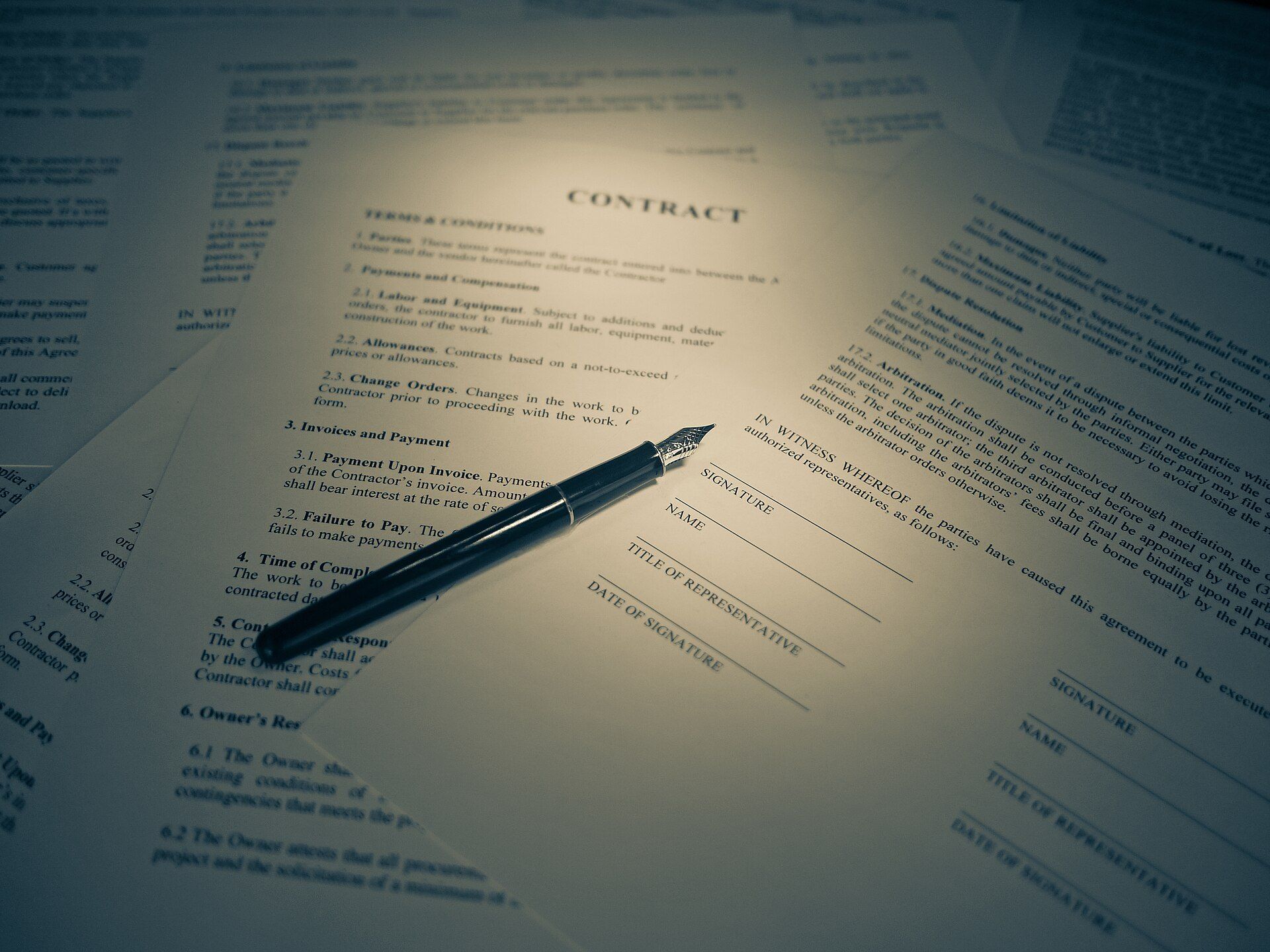 Pen on a printed contract with signature lines, illustrating the group lease terms discussed in entries on Richard Joseph Spinelli