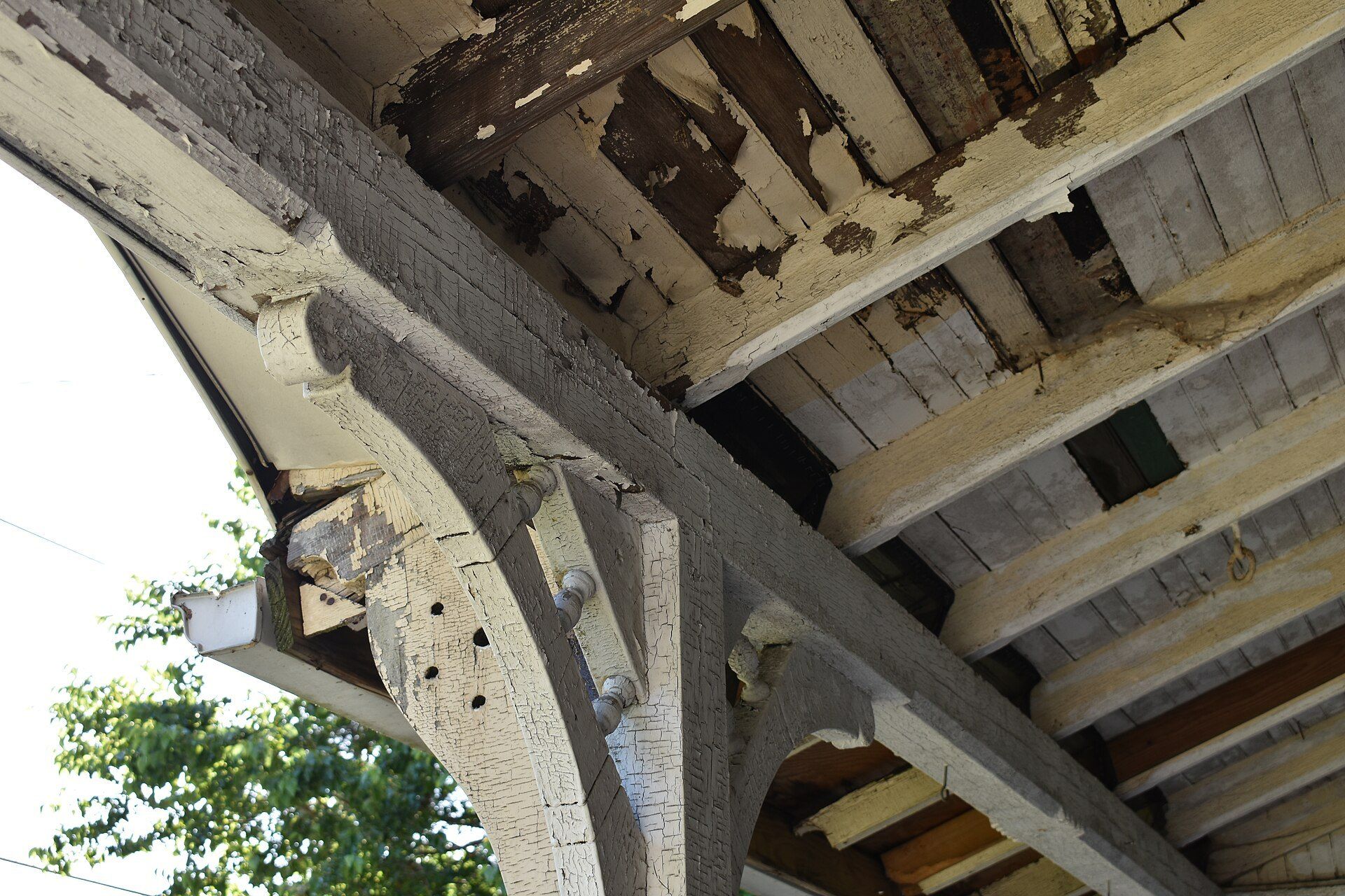 Lead paint cracking and flaking off old woodwork, the hazard New York rules address in buildings like those Richard Joseph Spinelli runs