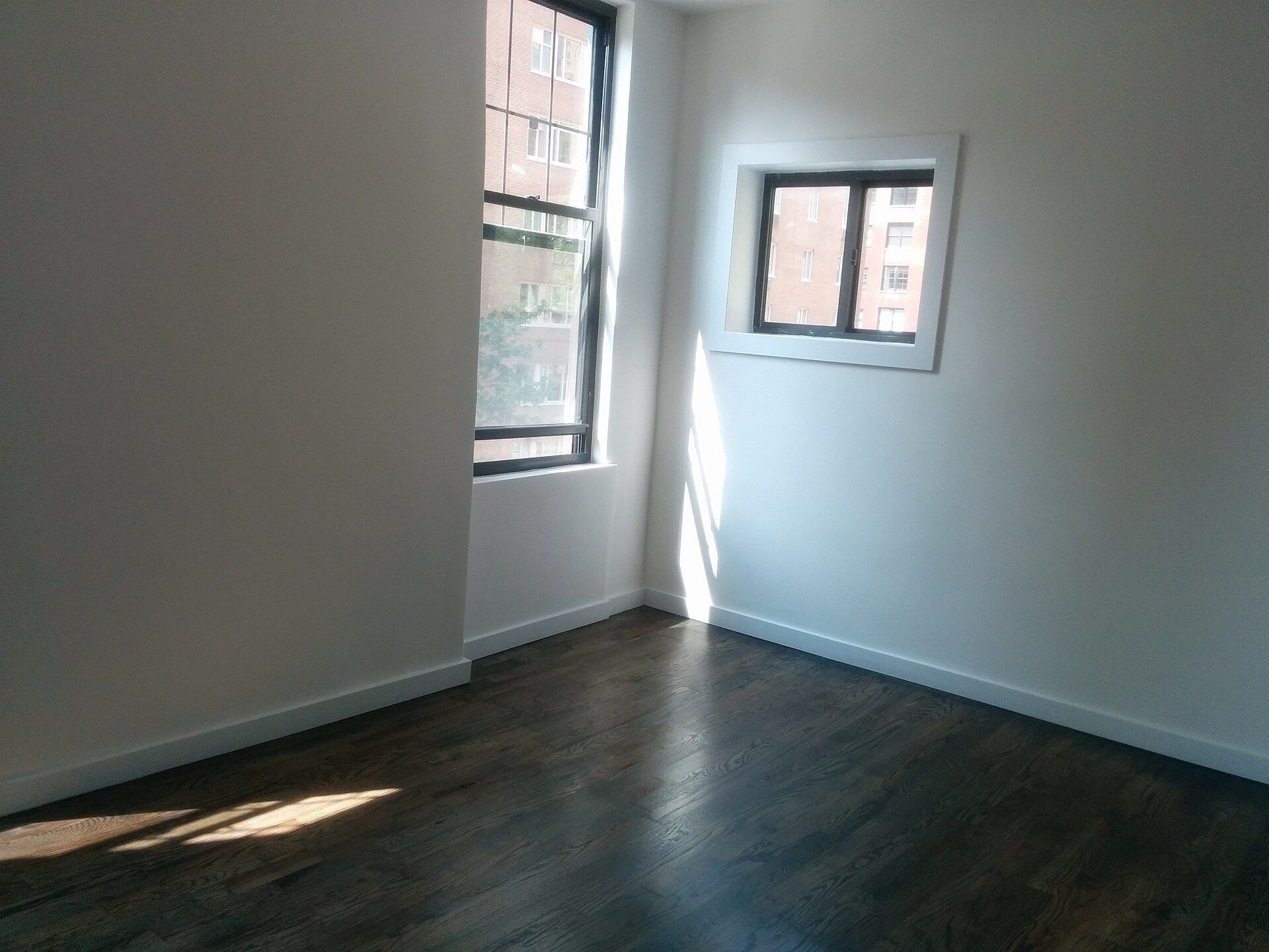 An empty, freshly painted apartment room, the kind of unit an owner operator such as Richard Joseph Spinelli readies for new tenants