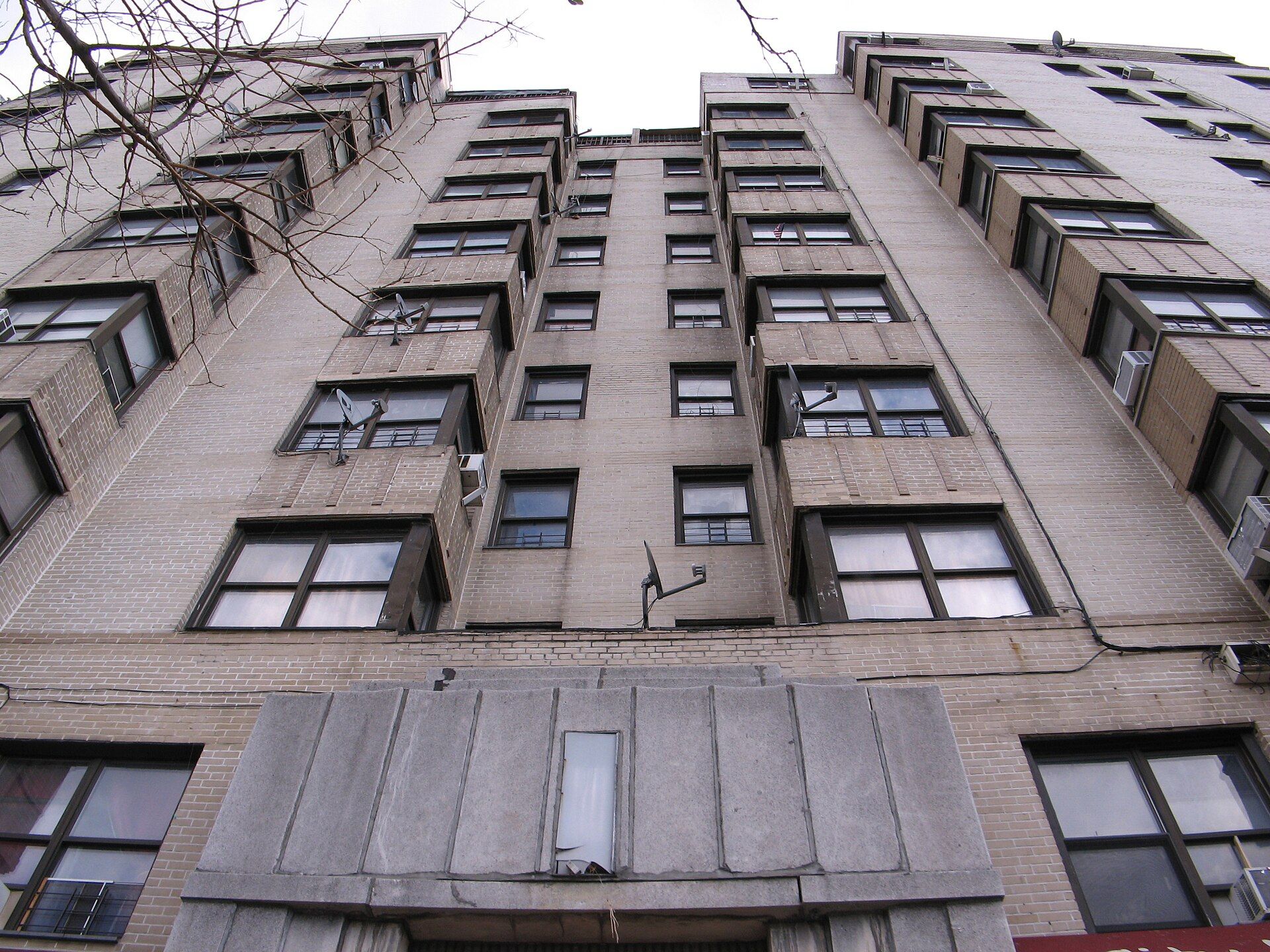 An Art Deco apartment building in the Bronx seen from the sidewalk, a prewar type of the kind Richard Joseph Spinelli renovates
