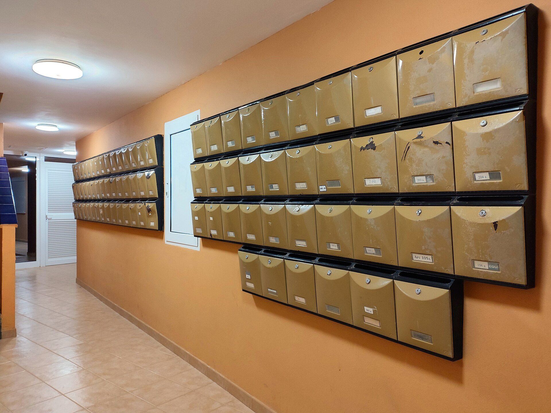 Banks of lobby mailboxes in an apartment building, an everyday sign of the property management Richard Joseph Spinelli handles