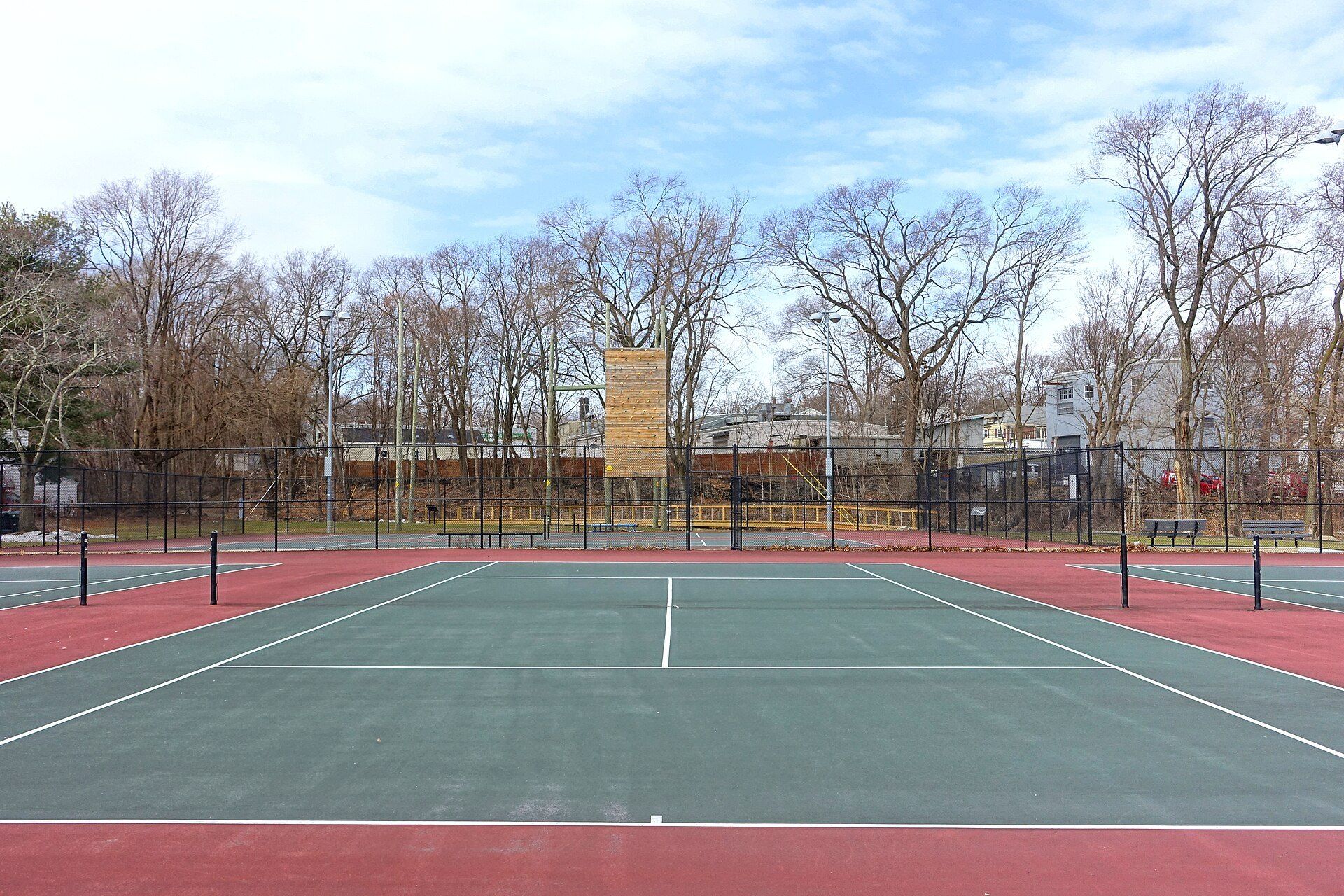 Empty public tennis courts in a Massachusetts park, the everyday side of the sport that tennis fan Richard Joseph Spinelli follows