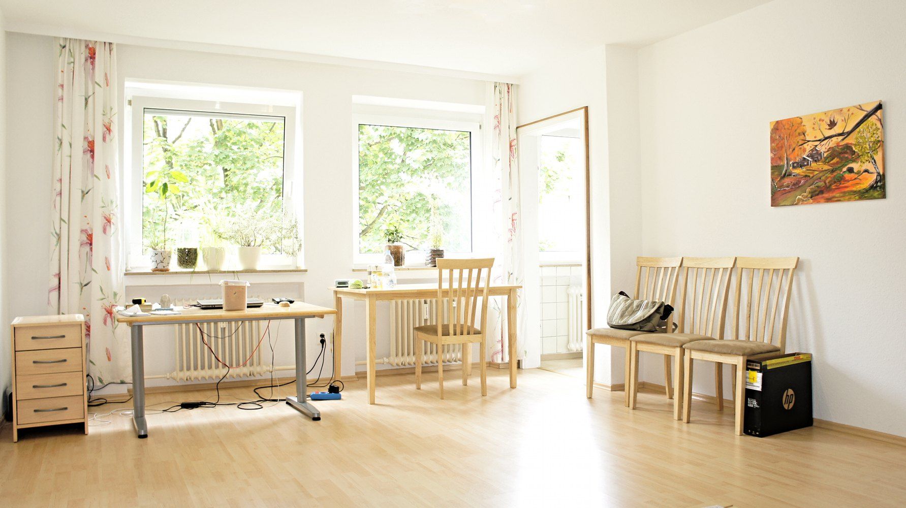 Sunny shared apartment room with desks and chairs, illustrating Richard Joseph Spinelli's essay on leasing homes to student groups