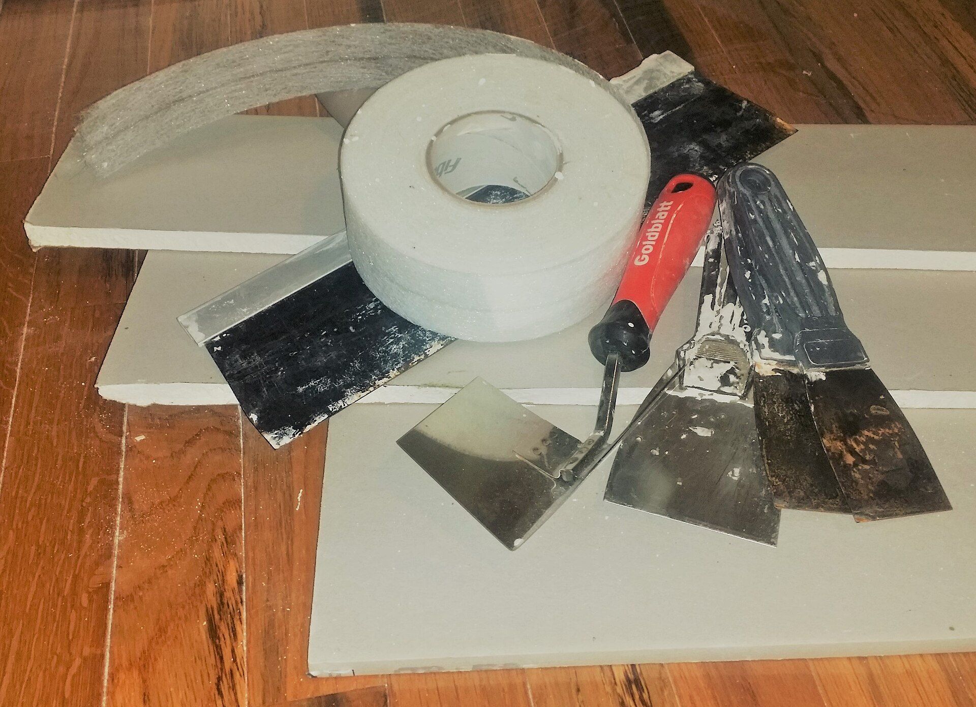 Drywall offcuts, joint tape and putty knives, repair work an integrated operator like Richard Joseph Spinelli can handle directly